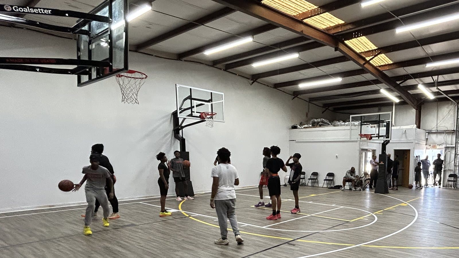 Players on the indoor court at Max Speed Elite in Columbia, South Carolina, with both hoops in view