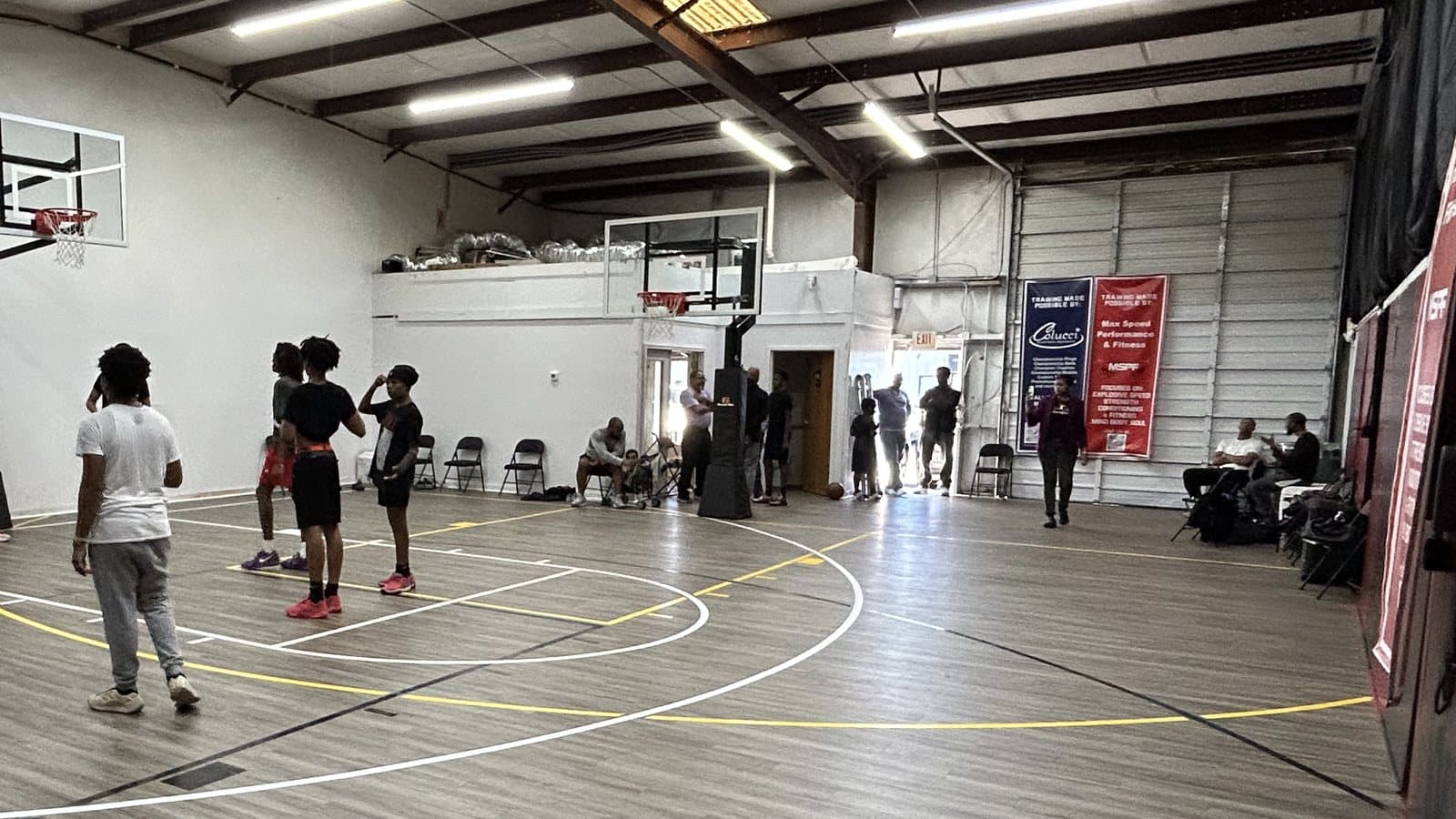 Young players and sideline seating at the indoor court at Max Speed Elite in Northeast Columbia, South Carolina